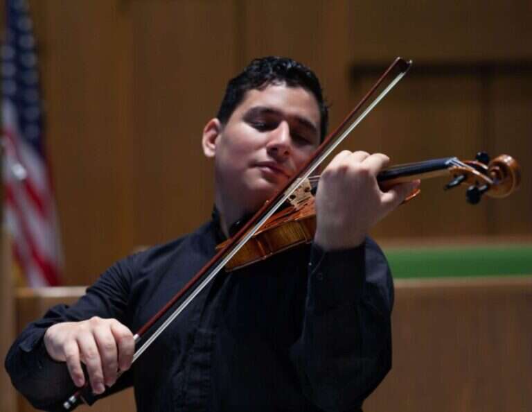 Mario Zelaya, resident musician and violin teacher in Studio 5 at Sugar Land Art Center